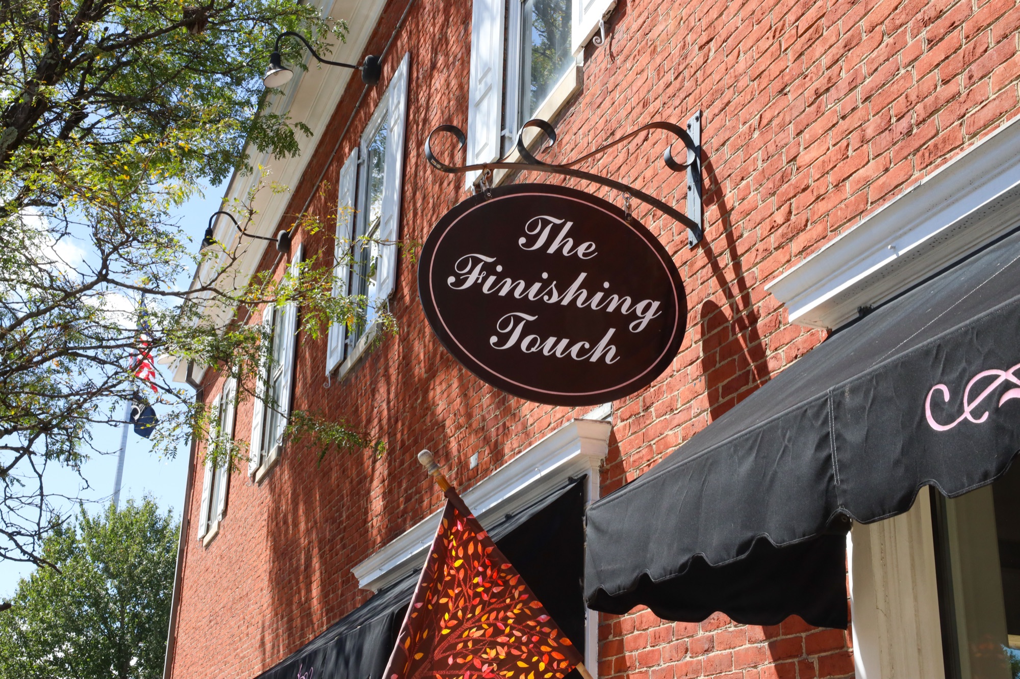 The Finishing Touch Store entrance and sign on North Market Street in Ligonier, Pennsylvania