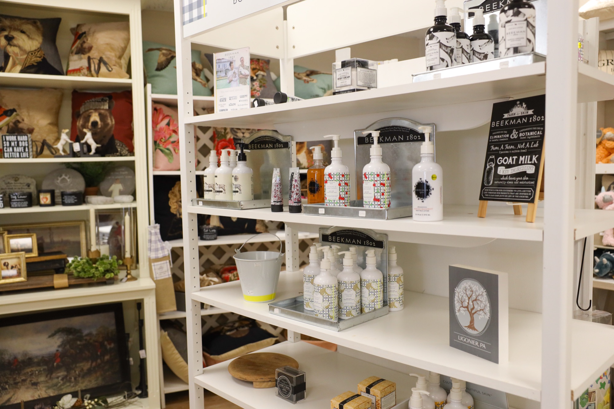 A curated shelf display of gift and home accent pieces at The Finishing Touch Store